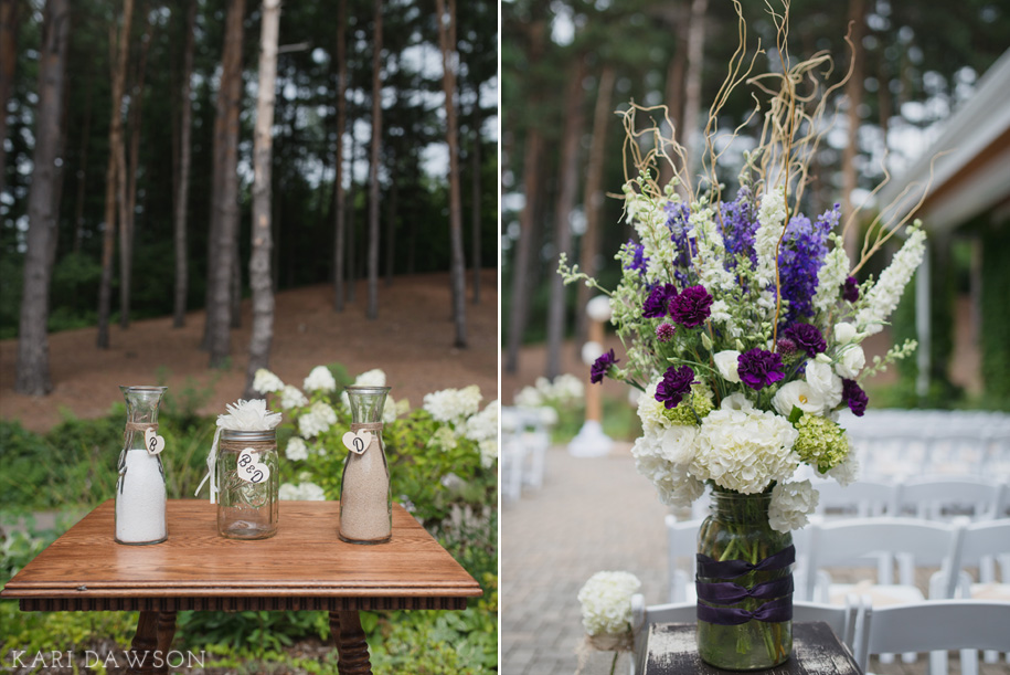 Rustic and elegant ceremony floral arrangements flank the aisle for this rustic elegant outdoor wedding ceremony in the woods l sand ceremony