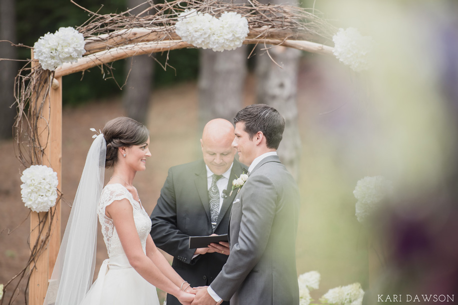 Rustic elegant outdoor ceremony in the woods l Black tie country club wedding l Rustic branch arbor l Hydrangeas 