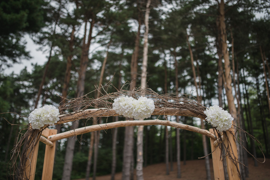 This rustic twig and branch arbor is perfect for a rustic elegant outdoor wedding ceremony in the woods