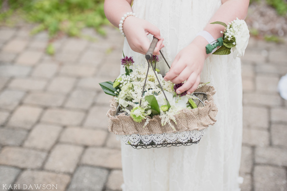 I'm dying over this rustic flower girl basket with rustic flowers for an elegant outdoor wedding ceremony in the woods.