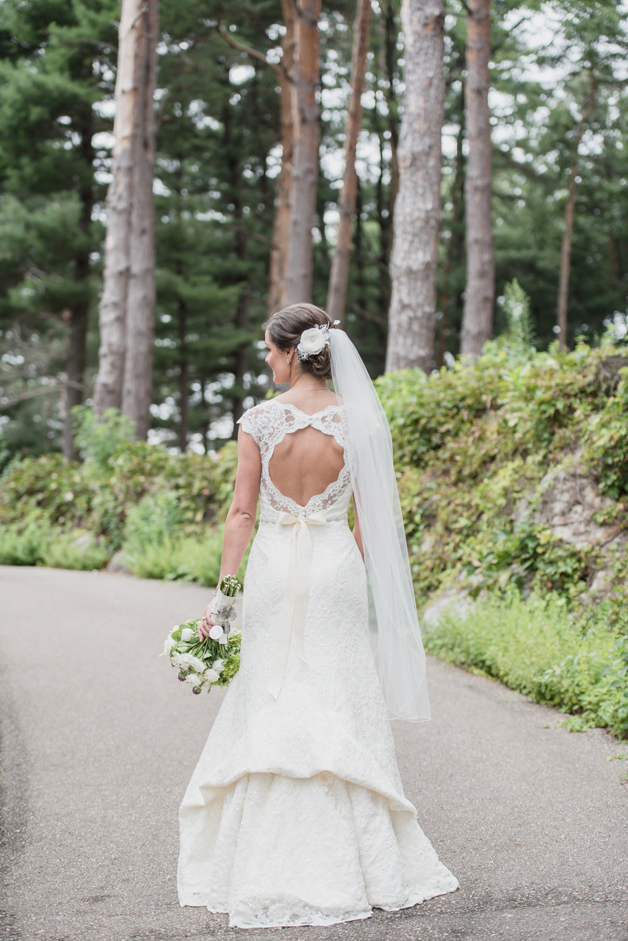 I love the way this lace wedding dress with open back bustles perfectly l Black tie country club wedding l Rustic elegance l Rustic bouquet l Up do l Veil