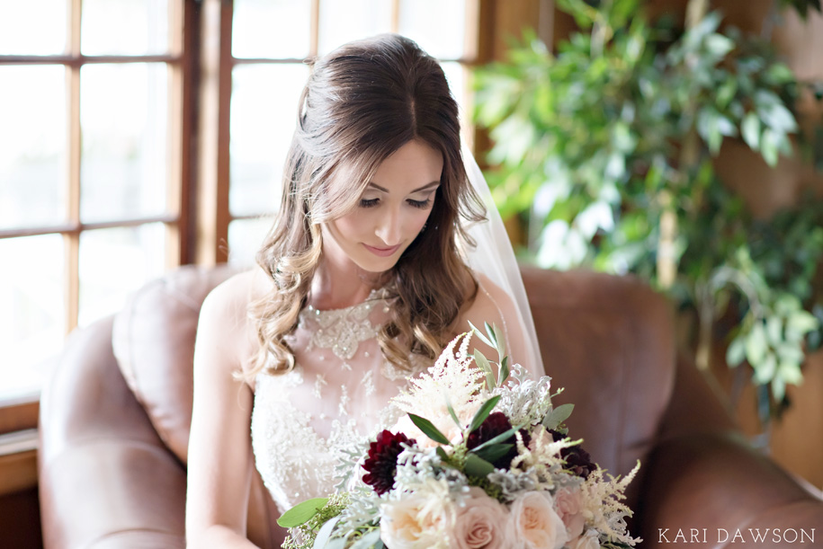 Gorgeous bridal portrait at Waldenwoods Ann Arbor, Michigan with a lace halter wedding dress and rustic bouquet.