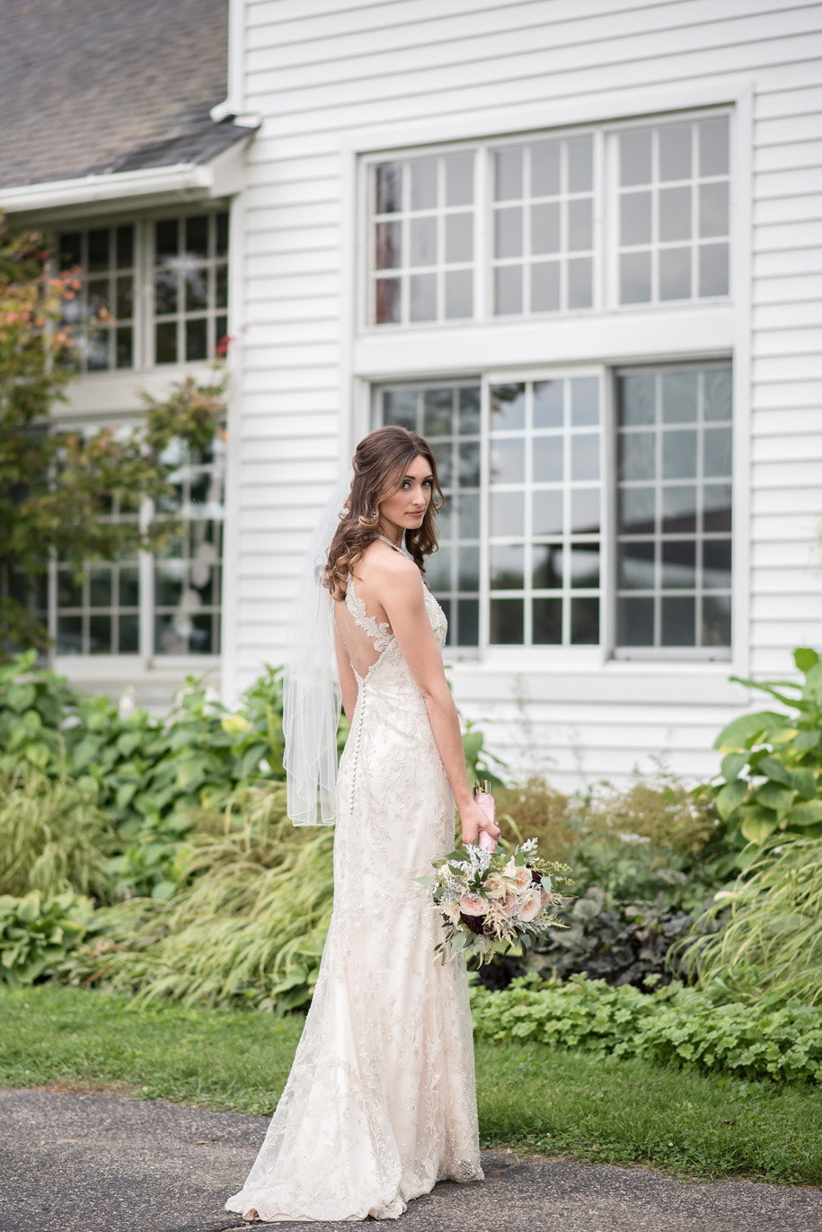 Gorgeous bridal portrait at Waldenwoods Ann Arbor, Michigan with a lace halter wedding dress and rustic bouquet in pinks, greens, and wine
