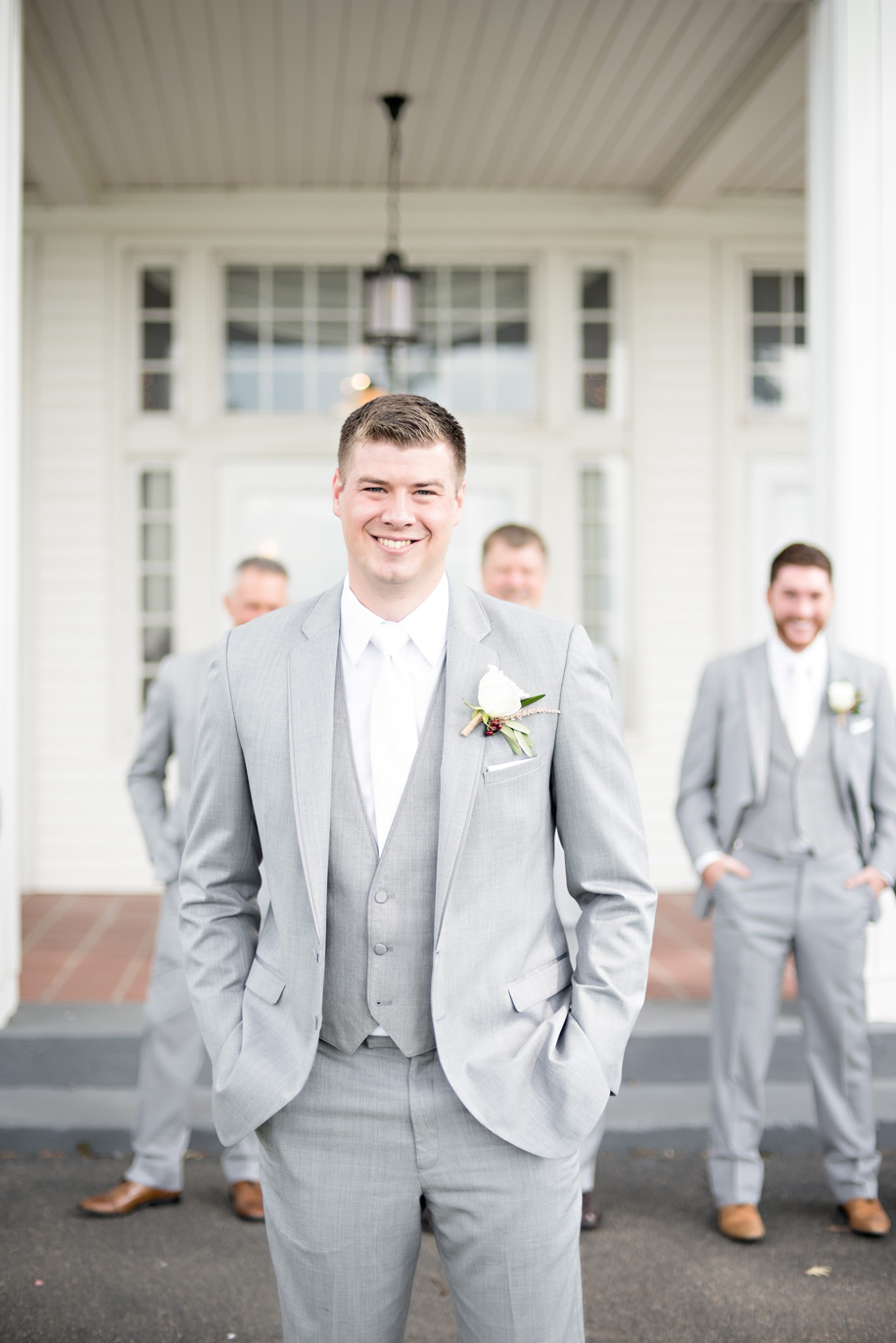 Groom's wedding day attire l gray suit l michael kors watch l Rustic Waldenwoods Hartland, Michigan Summer Wedding l Rose boutonniere with berries l White tie