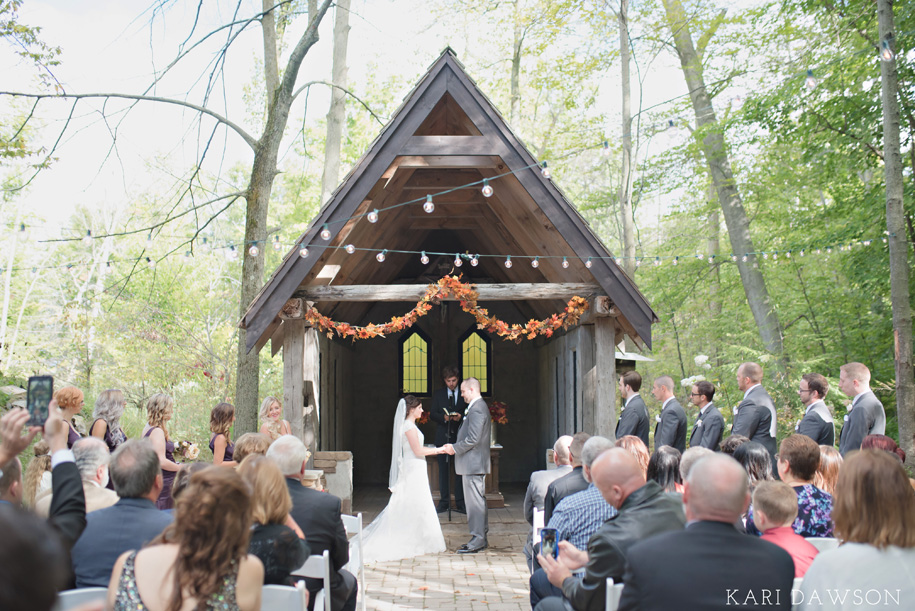 String Lights and Leaf Garland for an Outdoor Ceremony l Rustic and Romantic Outdoor Inner Circle Estate Wedding in the woods by Kari Dawson