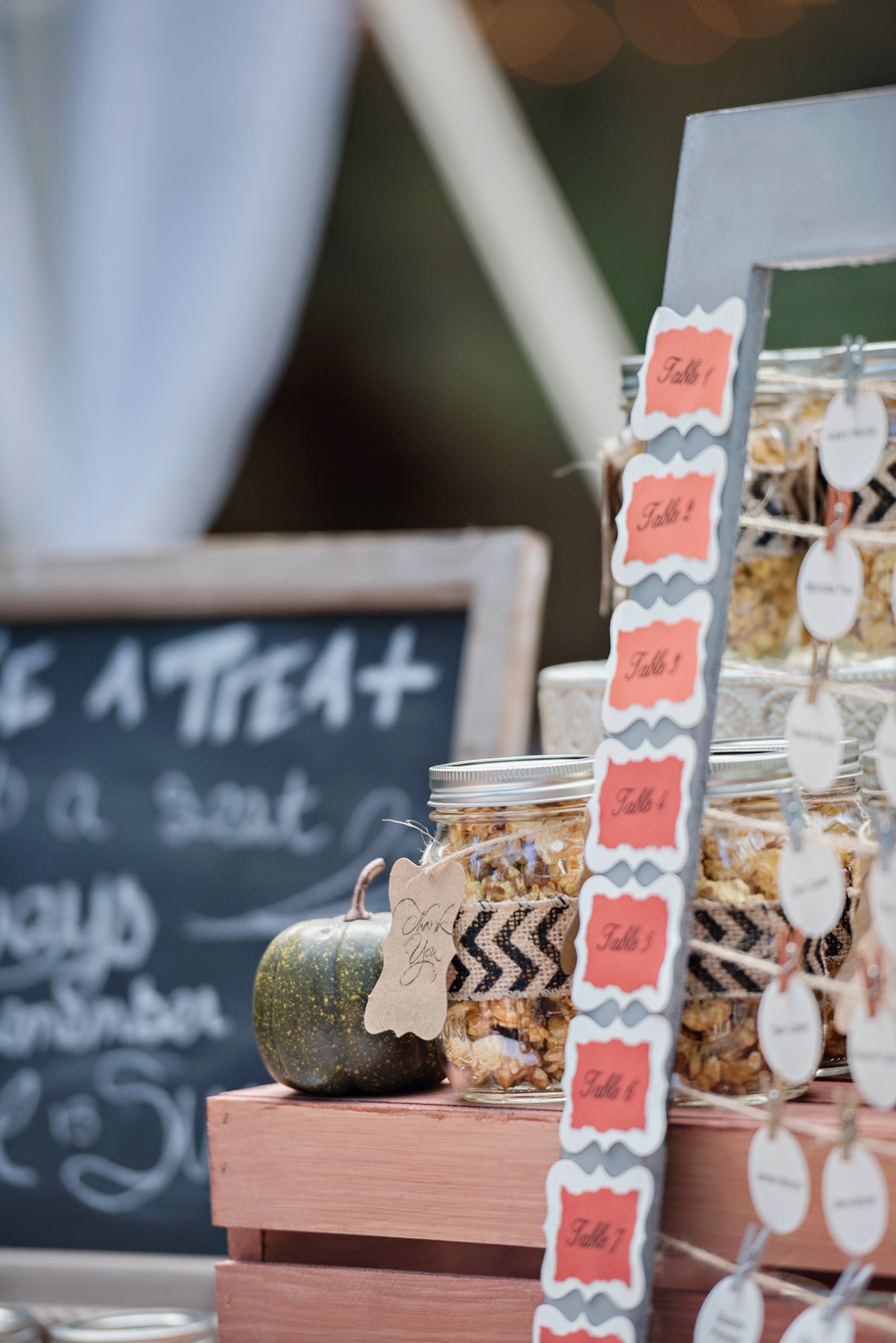 Use a frame without the glass to string your place cards l name cards l escort cards l Rustic and Romantic Outdoor Inner Circle Estate Wedding in the woods by Kari Dawson