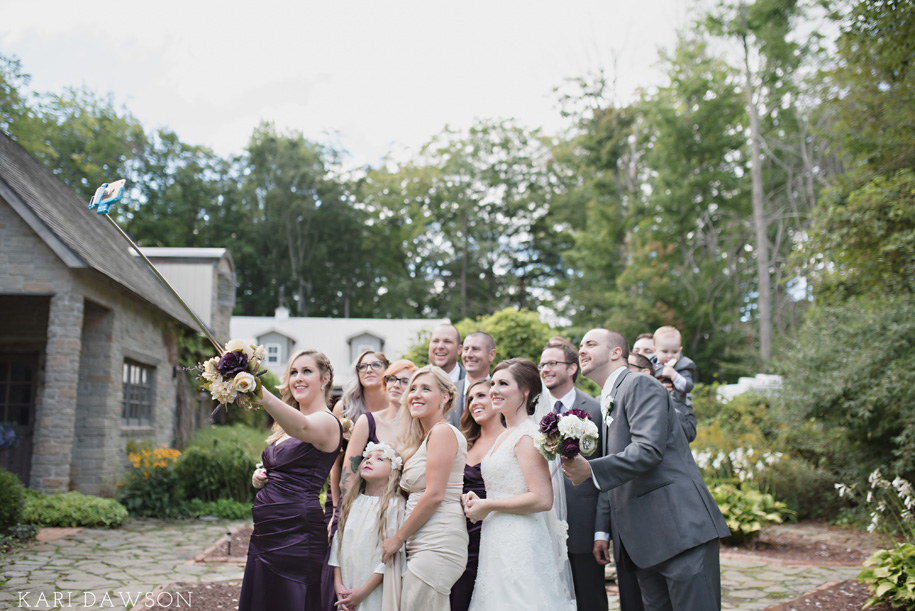 Bridal party have a bit of selfiestick fun l Purple, Cream and Grey Wedding l Use a frame without the glass to string your place cards l name cards l escort cards l Rustic and Romantic Outdoor Inner Circle Estate Wedding in the woods by Kari Dawson