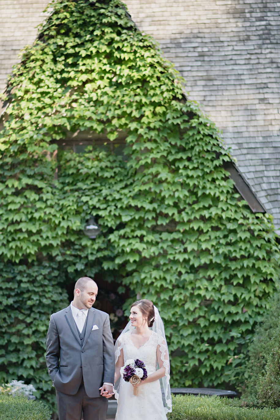 Bride and Groom Portrait in from of the Castle l Purple, Cream and Grey Wedding l Rustic and Romantic Outdoor Inner Circle Estate Wedding in the woods by Kari Dawson