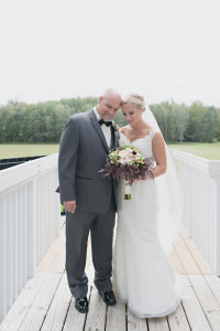 Private moment and first look of this bride with her dad on her wedding day . lace mermaid style wedding dress with off the should cap sleeves and sheer back with buttons by Kari Dawson Photography