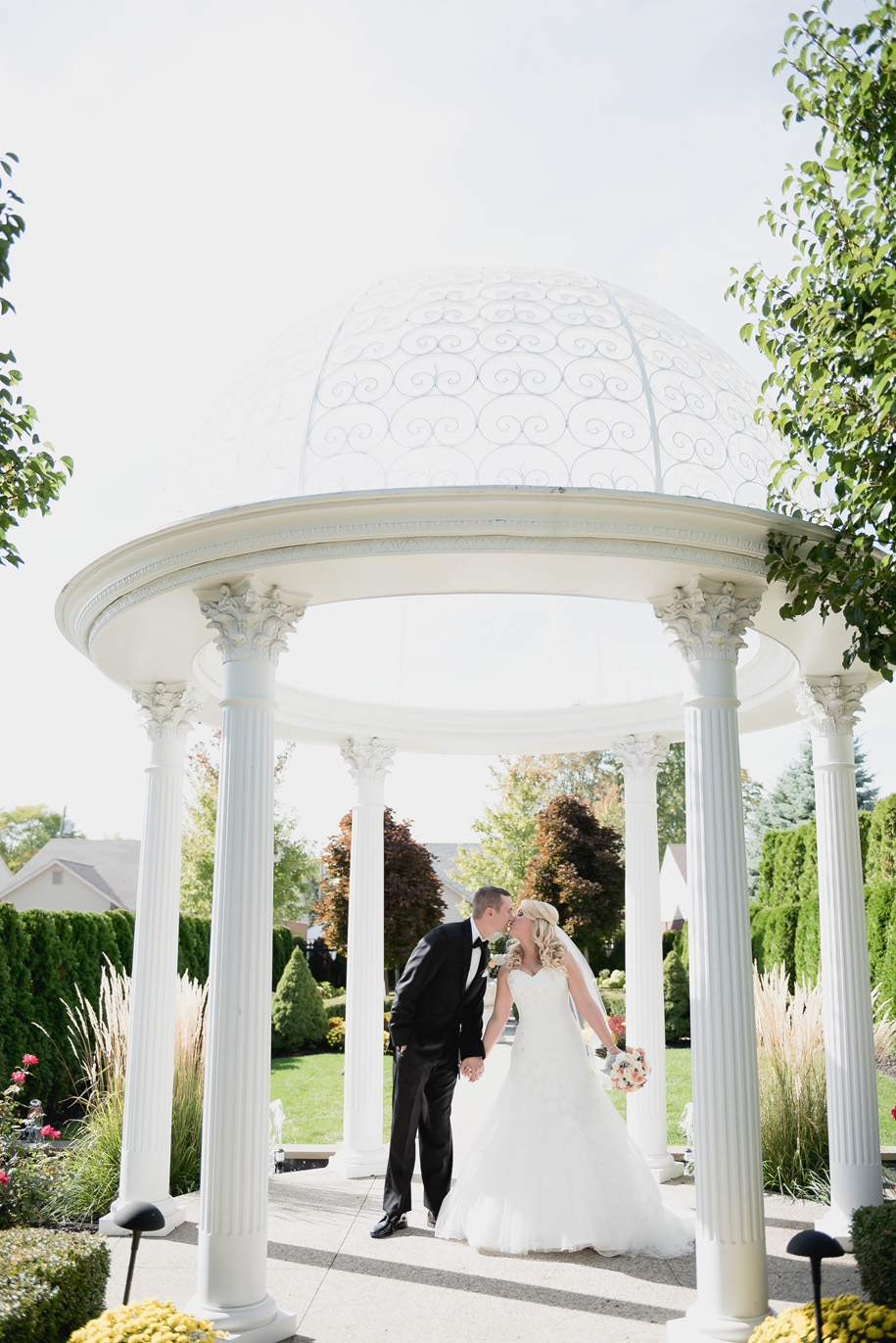 Bride and groom portraits at a fall wedding in Michigan by Kari Dawson