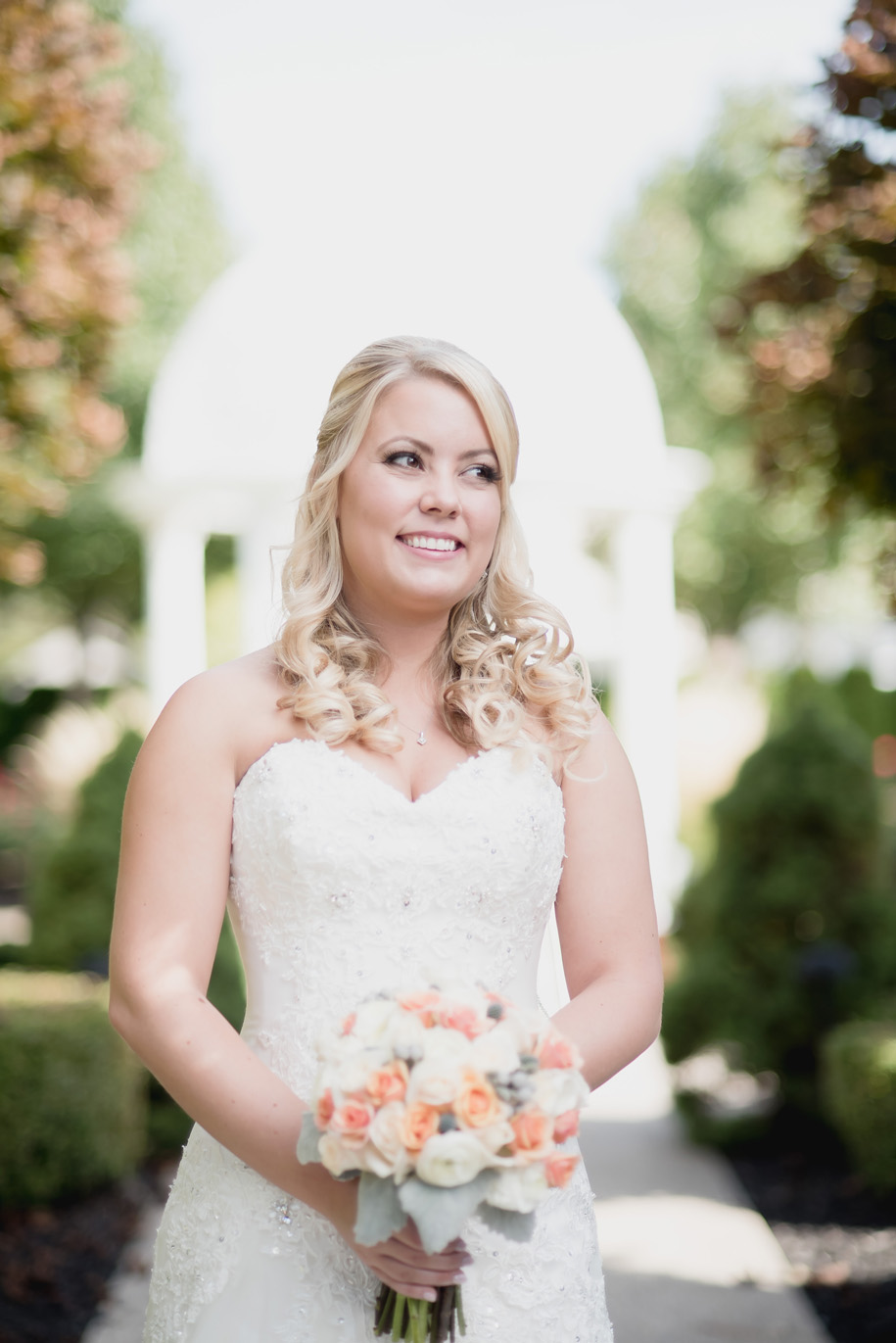 Romantic and classic pastel bride wedding day bouquet in neutral tones of cream and grey with pops of pink and peach for this fall Michigan wedding by Kari Dawson.