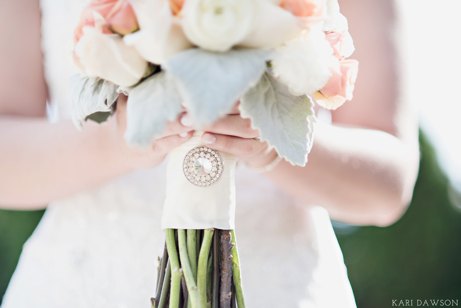 Romantic and classic pastel bride wedding day bouquet in neutral tones of cream and grey with pops of pink and peach for this fall Michigan wedding by Kari Dawson.
