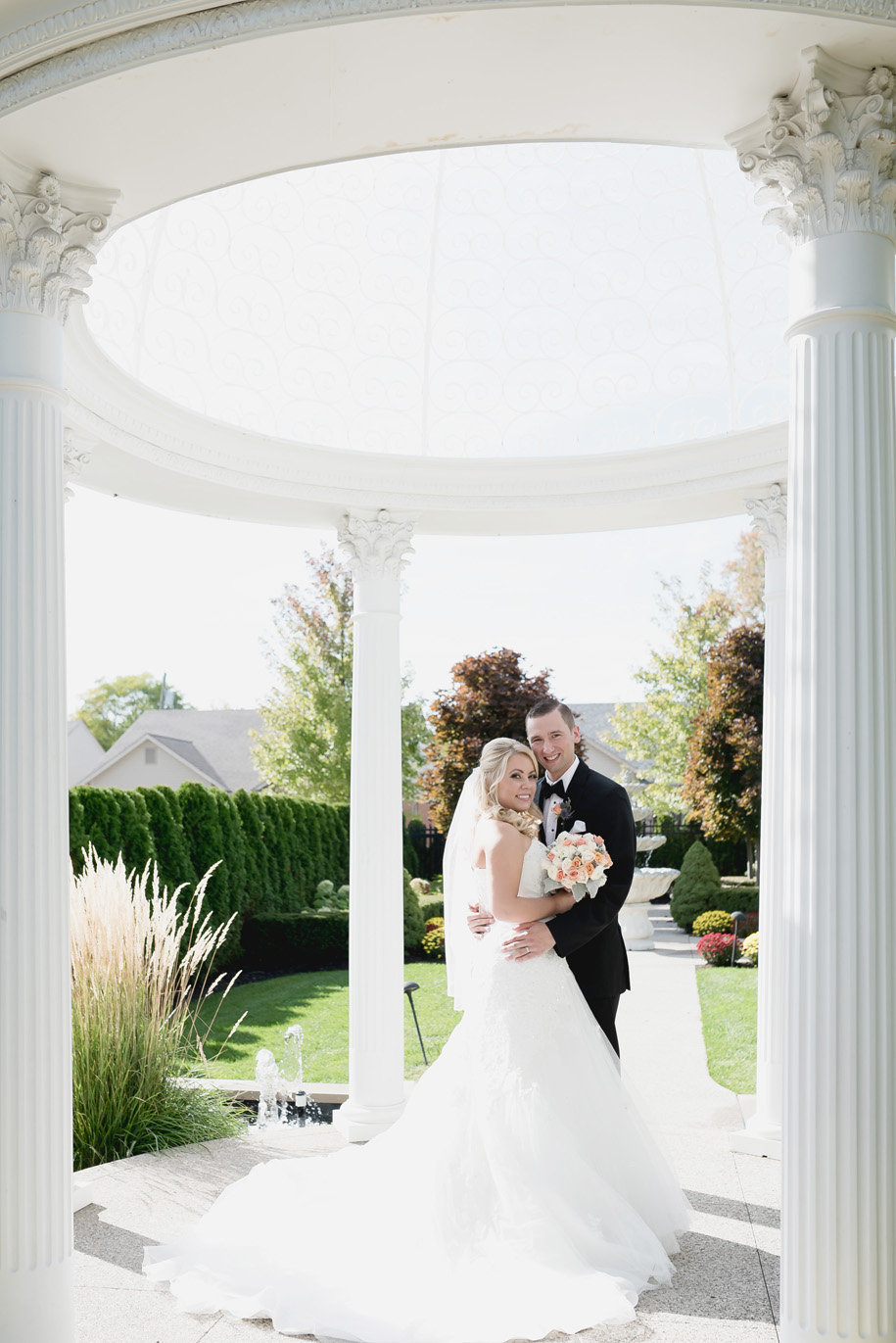 Bride and groom portraits at a fall wedding in Michigan by Kari Dawson