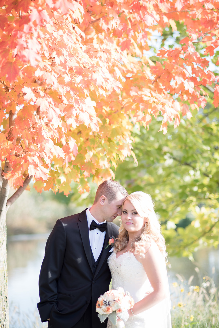 George George Park Bride and groom portraits at a fall wedding in Michigan by Kari Dawson