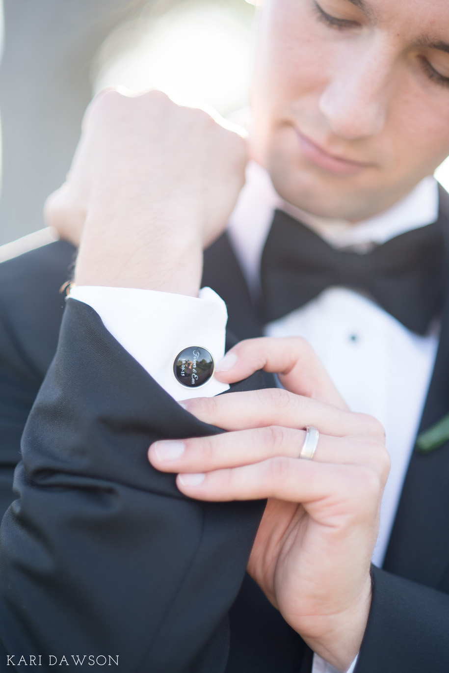 Classic Groom Portrait on his wedding day in his traditional black tuxedo and blow tie . An Autumn Wedding Chapel Wedding in Michigan