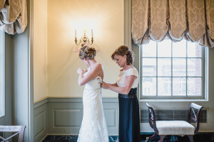 Lovett Hall at Greenfield Village winter wedding by Kari Dawson. Top rated Southeastern Michigan documentary wedding photographer.