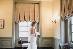 Lovett Hall at Greenfield Village winter wedding by Kari Dawson. Top rated Southeastern Michigan documentary wedding photographer.