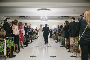 Lovett Hall at Greenfield Village winter wedding by Kari Dawson. Top rated Southeastern Michigan documentary wedding photographer.