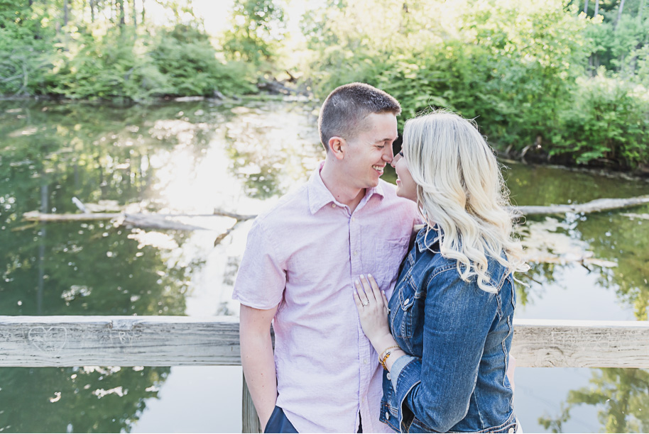 Summer engagement photos in the park in Washington, Michigan at Stony Creek Metropark provided by Kari Dawson, top-rated Michigan wedding photographer and her team.