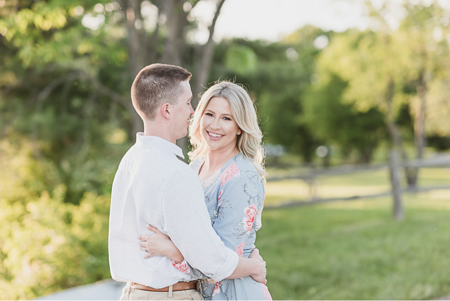 Summer engagement photos in the park in Washington, Michigan at Stony Creek Metropark provided by Kari Dawson, top-rated Michigan wedding photographer and her team.
