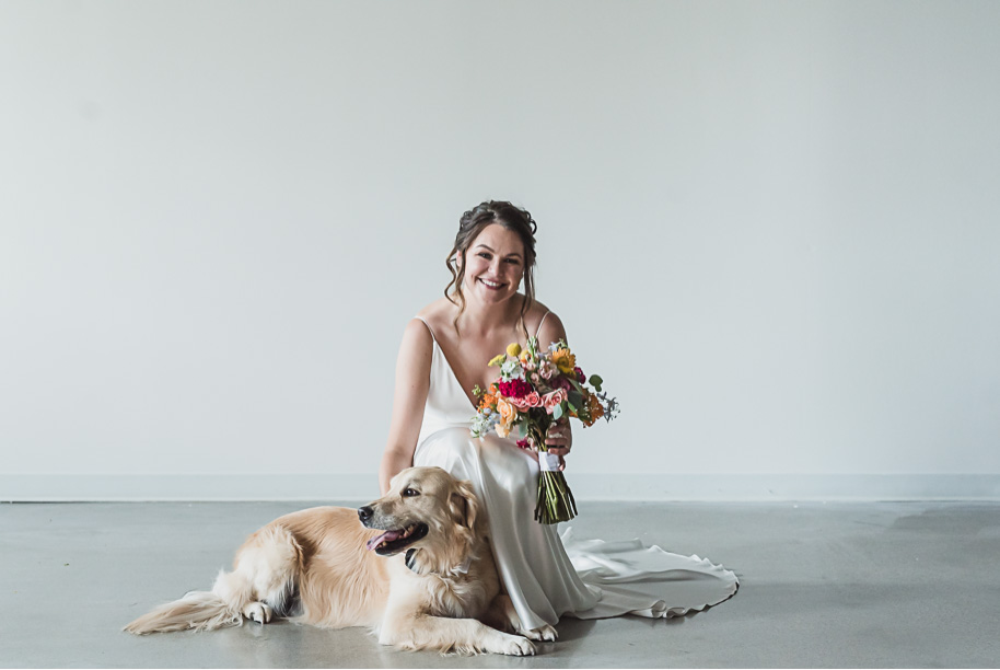 A bride and her puppy on her wedding day! Coral and Gray College for Creative Studies Summer Wedding in Detroit, Michigan by Kari Dawson Photography.