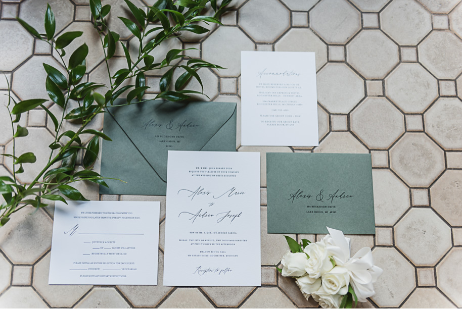 Sage green and white classic wedding invitation suite with custom calligraphy. This Black and white summer Meadow Brook Hall wedding in Rochester, Michigan is elegant, modern, romantic, yet unique, and classic. Provided by Kari Dawson, top-rated Rochester wedding photographer, and her team. 