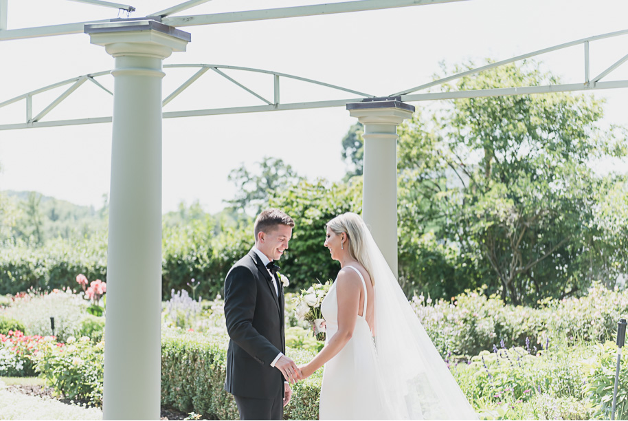 Touching first look. This Black and white summer Meadow Brook Hall wedding in Rochester, Michigan is elegant, modern, romantic, yet unique, and classic. Provided by Kari Dawson, top-rated Rochester wedding photographer, and her team. 