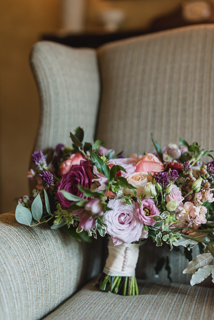 I am obsessed with this colorful unstructured wedding bouquet! Colorful Meadow Brook Mansion wedding in Rochester, Michigan provided by Kari Dawson, top-rated Rochester, Michigan wedding photographer, and her team. 