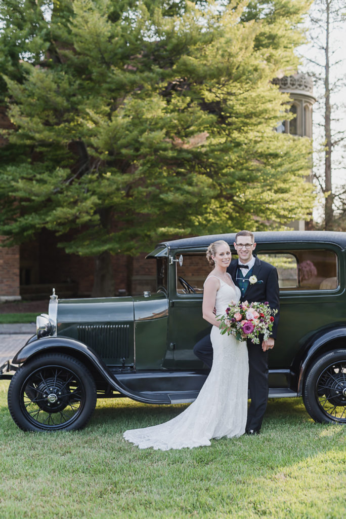 Can I get a classic Model T at every estate wedding? Colorful Meadow Brook Mansion wedding in Rochester, Michigan provided by Kari Dawson, top-rated Rochester, Michigan wedding photographer, and her team. 