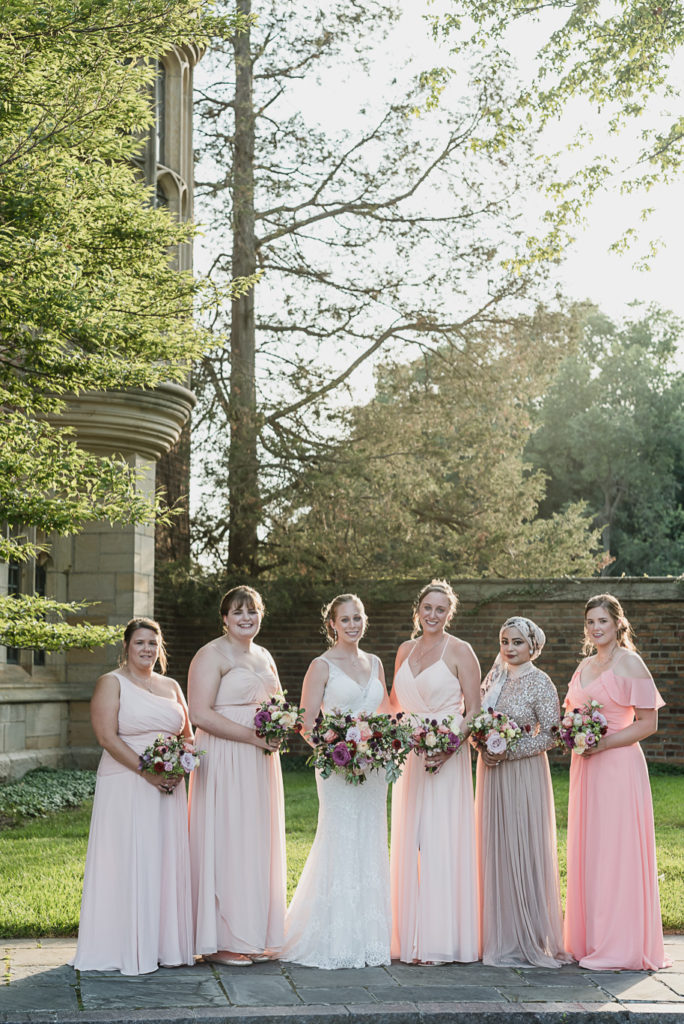 Mix and match bridesmaid dresses done right. Colorful Meadow Brook Mansion wedding in Rochester, Michigan provided by Kari Dawson, top-rated Rochester, Michigan wedding photographer, and her team. 