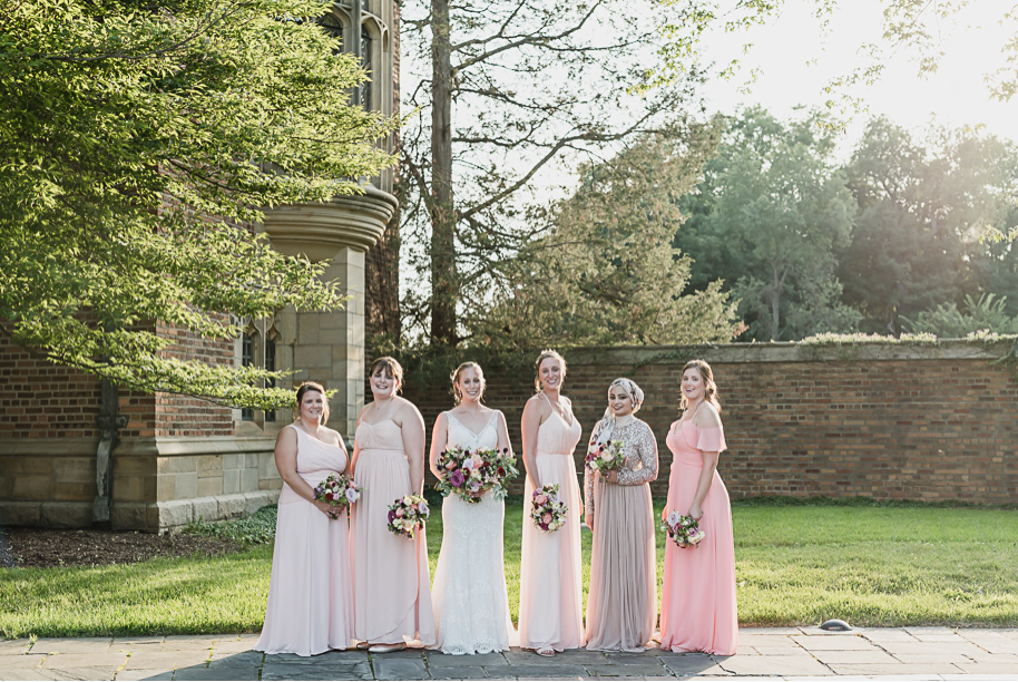 Mix and match bridesmaid dresses done right. Colorful Meadow Brook Mansion wedding in Rochester, Michigan provided by Kari Dawson, top-rated Rochester, Michigan wedding photographer, and her team. 