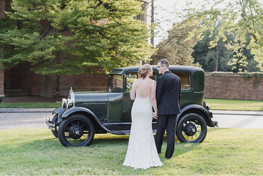 Can I get a classic Model T at every estate wedding? Colorful Meadow Brook Mansion wedding in Rochester, Michigan provided by Kari Dawson, top-rated Rochester, Michigan wedding photographer, and her team. 