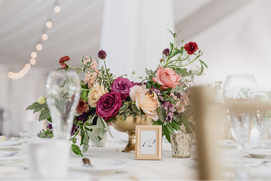 This rustic unstructured wedding day centerpiece is so on trend! Colorful Meadow Brook Mansion wedding in Rochester, Michigan provided by Kari Dawson, top-rated Rochester, Michigan wedding photographer, and her team. 