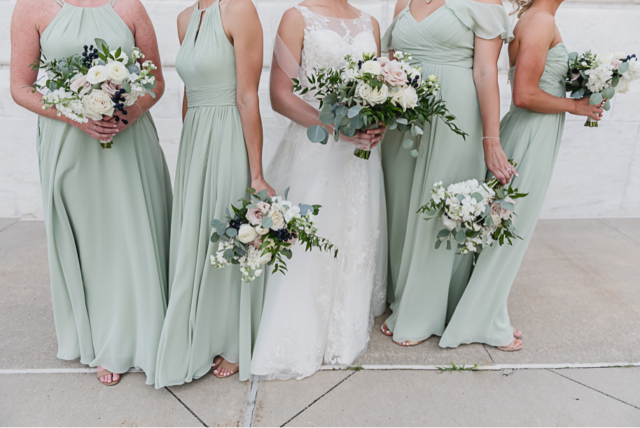 Sage mix and match floor length bridesmaid dresses. Sage and navy summer wedding at the Detroit Athletic Club in Detroit, Michigan provided by Kari Dawson, top-rated Detroit wedding photographer, and her team.