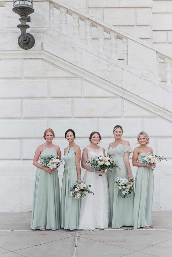 Mix and match sage floor length bridesmaid dresses. Sage and navy summer wedding at the Detroit Athletic Club in Detroit, Michigan provided by Kari Dawson, top-rated Detroit wedding photographer, and her team.
