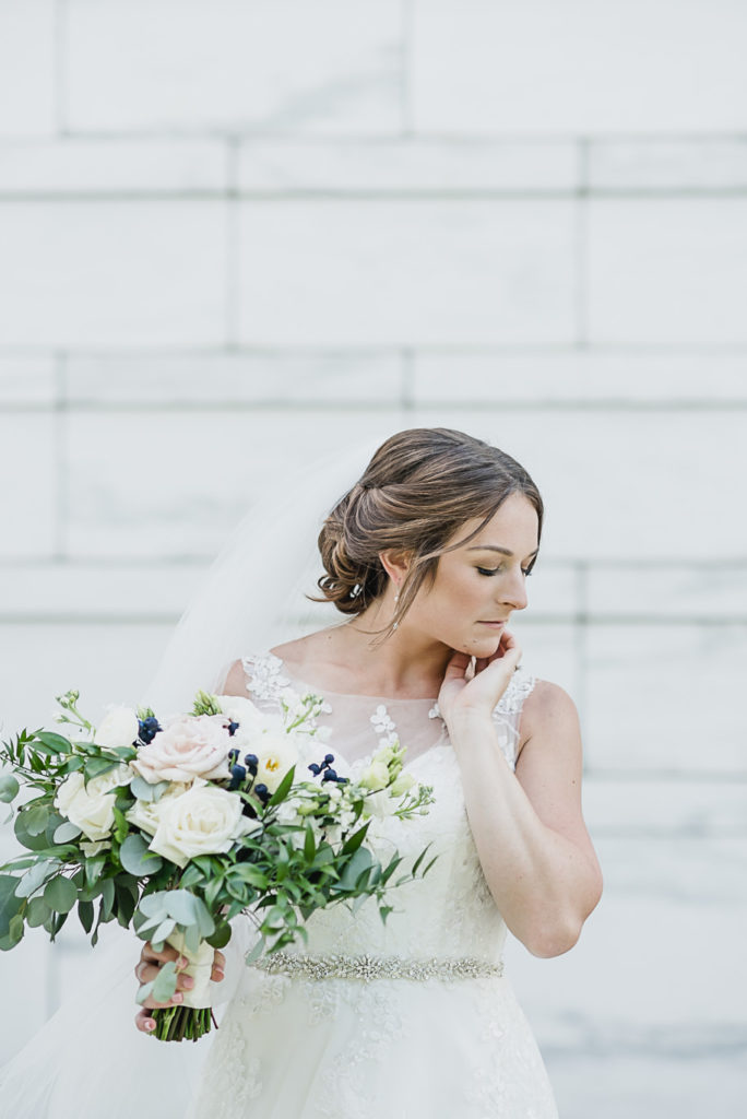 For the love of a perfect unstructured wedding bouquet! Sage and navy summer wedding at the Detroit Athletic Club in Detroit, Michigan provided by Kari Dawson, top-rated Detroit wedding photographer, and her team.