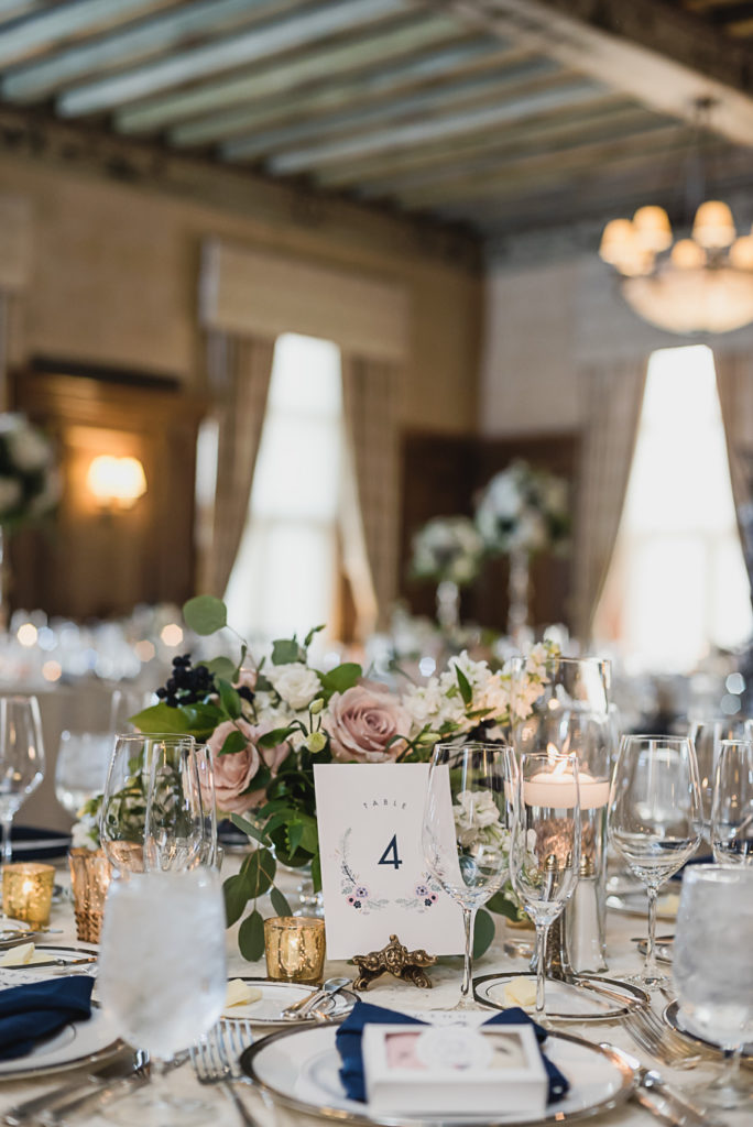 Custom table numbers that match the wedding invitation suite. Sage and navy summer wedding at the Detroit Athletic Club in Detroit, Michigan provided by Kari Dawson, top-rated Detroit wedding photographer, and her team.