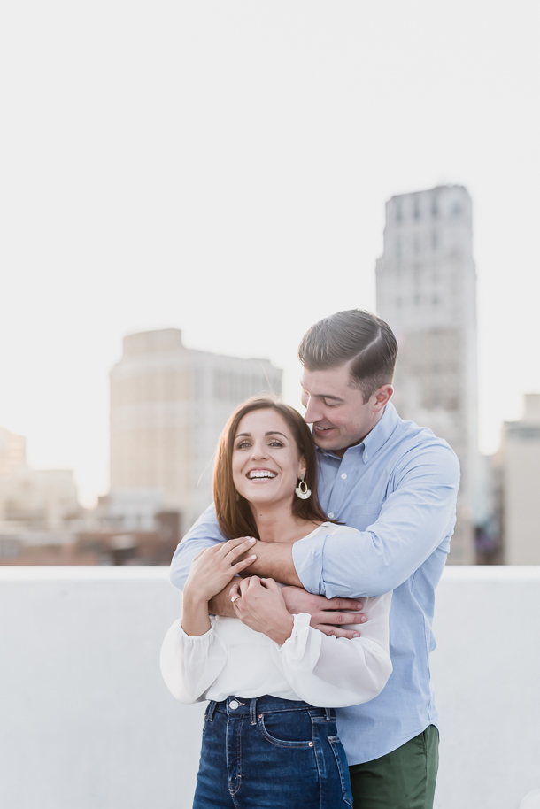Sarah and Patrick's Downtown Detroit engagement photos, by Kari Dawson, were captured on the top level of the Z Lot parking garage in Detroit, Michigan during a perfect summer sunset.