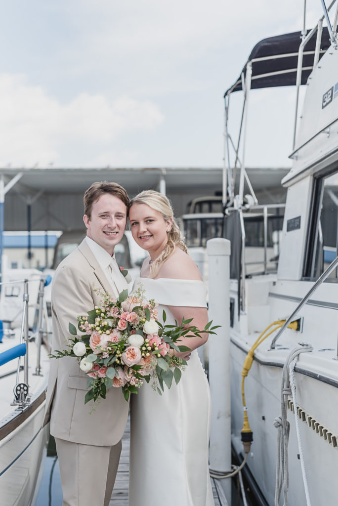 Khaki and teal Infinity Yacht wedding in St. Clair Shores, Michigan is provided by Kari Dawson, top-rated Metro Detroit wedding photographer, and her team.
