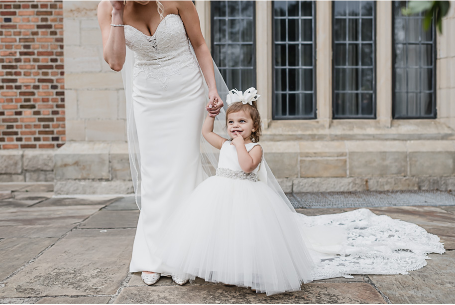 Cutest flower girl! Gray and navy Meadow Brook wedding at Meadow Brook Hall and Gardens in Rochester, Michigan provided by Kari Dawson, top-rated Rochester engagement and wedding photographer, and her team. 