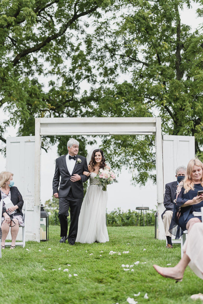 A Northern Michigan Aurora Cellars Vineyard Wedding in Traverse City, Michigan provided by Kari Dawson top-rated Northern Michigan Wedding Photographer and her team.
