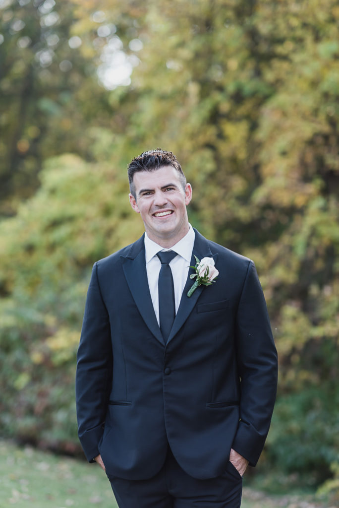An intimate black tie backyard wedding in Armada Michigan provided by Kari Dawson top rated Southeastern Michigan wedding photographer and her team.