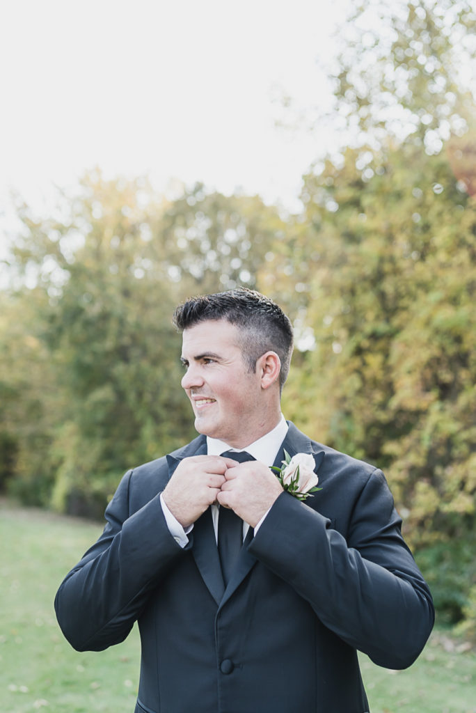An intimate black tie backyard wedding in Armada Michigan provided by Kari Dawson top rated Southeastern Michigan wedding photographer and her team.
