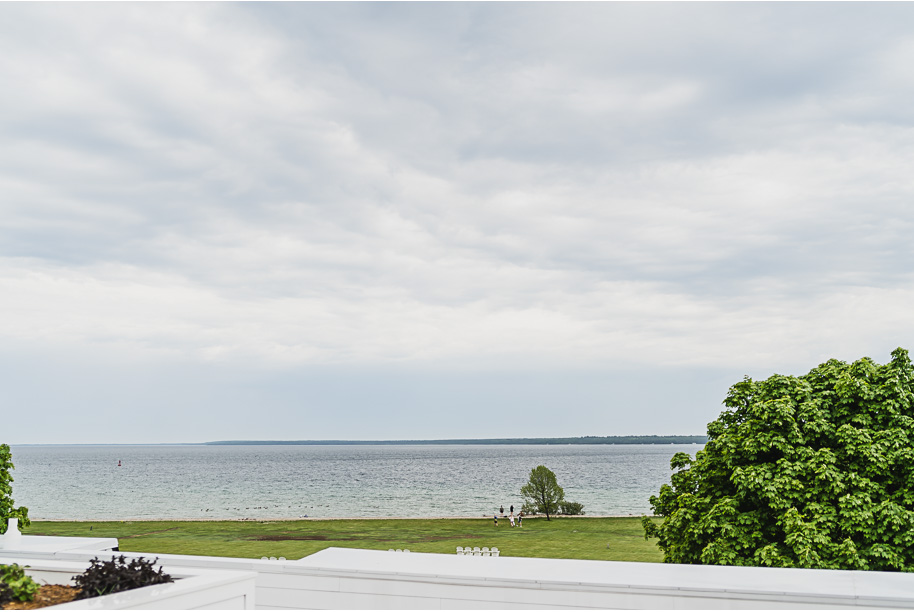 An intimate destination Mackinac Island wedding at Mission Point Resort with a cranberry and black color palette provided by Kari Dawson, top-rated Northern Michigan wedding photographer, and her team.