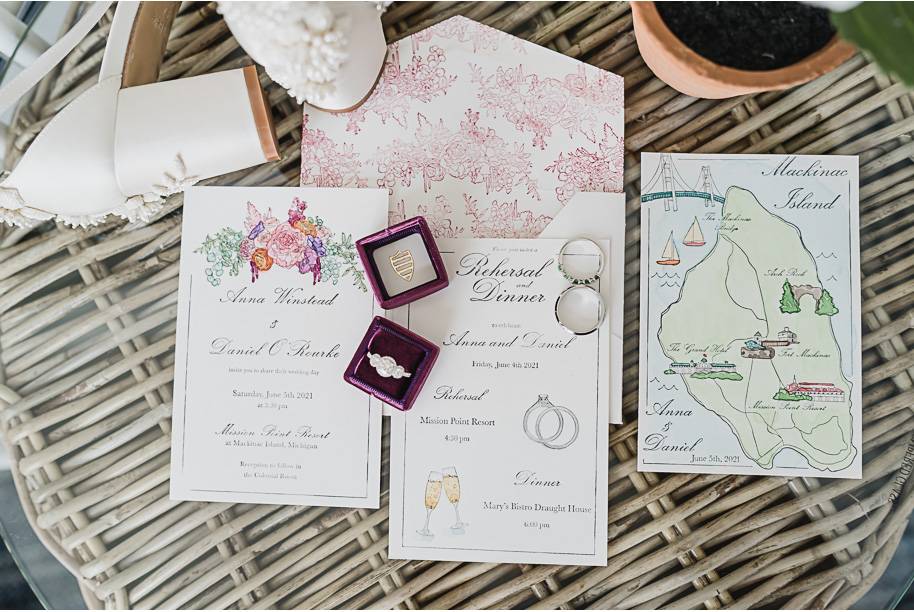 Hand-painted custom wedding invitation suite. 

An intimate destination Mackinac Island wedding at Mission Point Resort with a cranberry and black color palette provided by Kari Dawson, top-rated Northern Michigan wedding photographer, and her team.