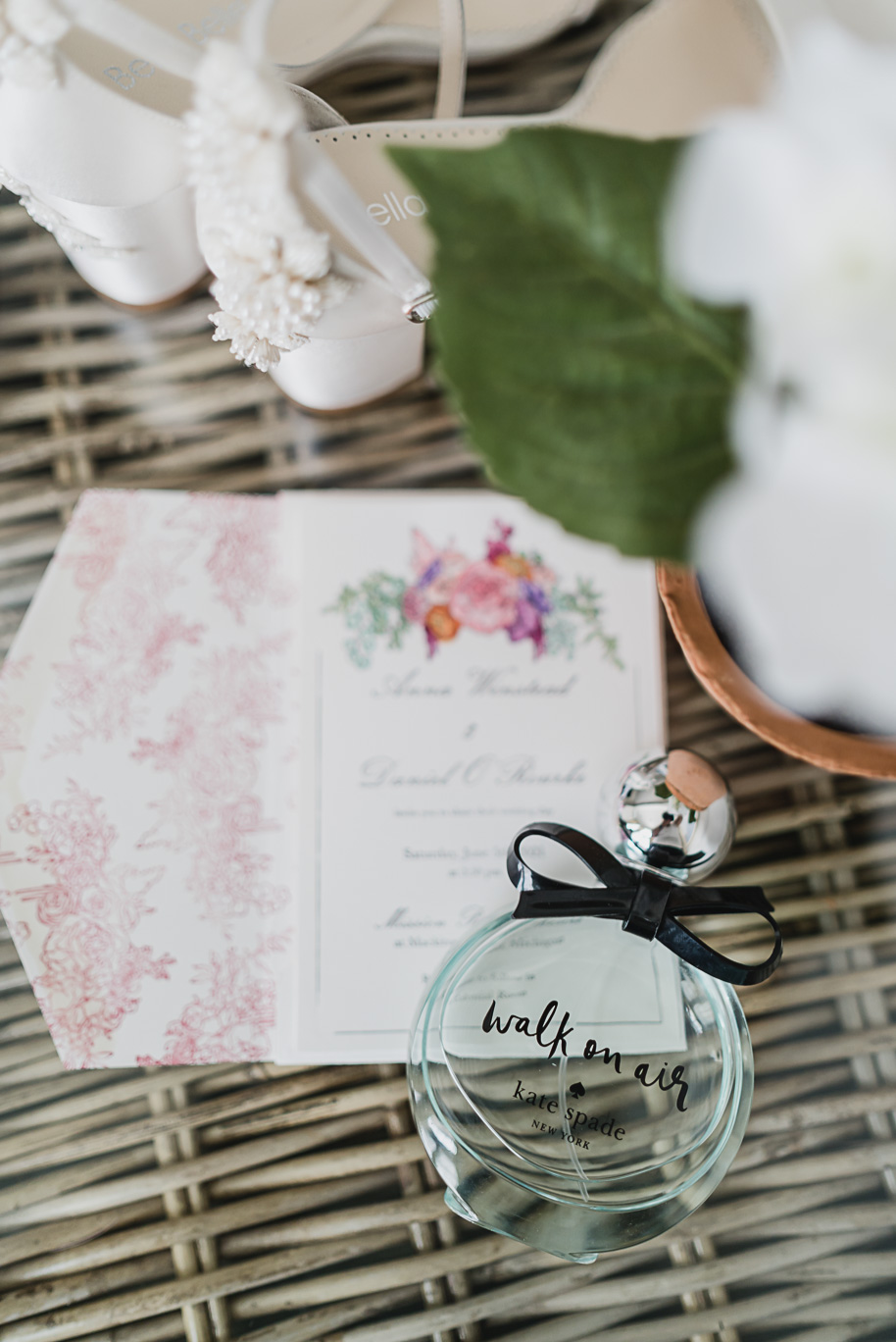Kate Spade Walk on aIr perfume.

An intimate destination Mackinac Island wedding at Mission Point Resort with a cranberry and black color palette provided by Kari Dawson, top-rated Northern Michigan wedding photographer, and her team.
