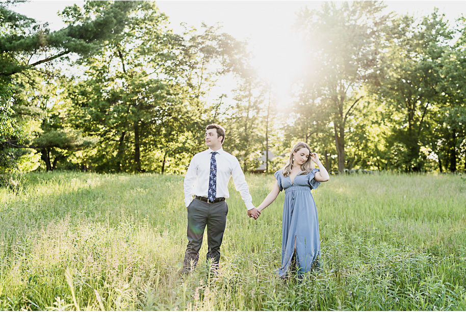 Romantic sunset Stony Creek Metro Park summer engagement photos in Michigan provided by Kari Dawson, top-rated Metro Detroit wedding photographer, and her team. 
