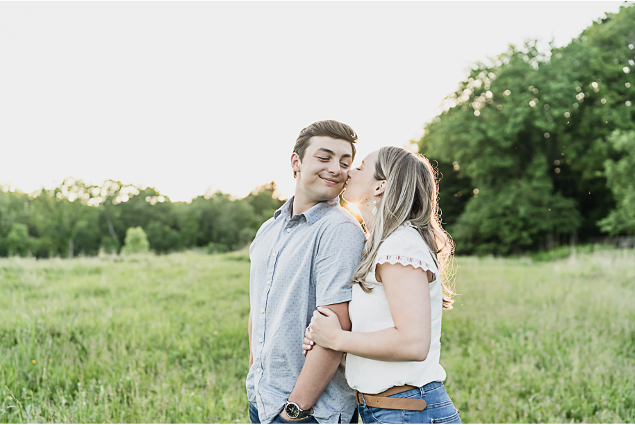 Romantic sunset Stony Creek Metro Park summer engagement photos in Michigan provided by Kari Dawson, top-rated Metro Detroit wedding photographer, and her team. 