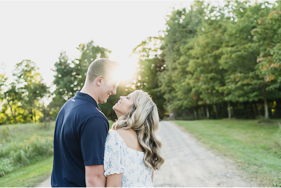 Fall romantic sunset engagement pictures at Stony Creek Metro Park in Washington, Michigan provided by Kari Dawson, top-rated Metro Detroit wedding photographer, and her team.