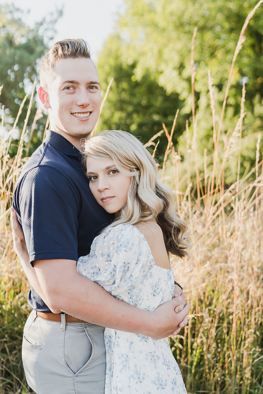 Fall romantic sunset engagement pictures at Stony Creek Metro Park in Washington, Michigan provided by Kari Dawson, top-rated Metro Detroit wedding photographer, and her team.